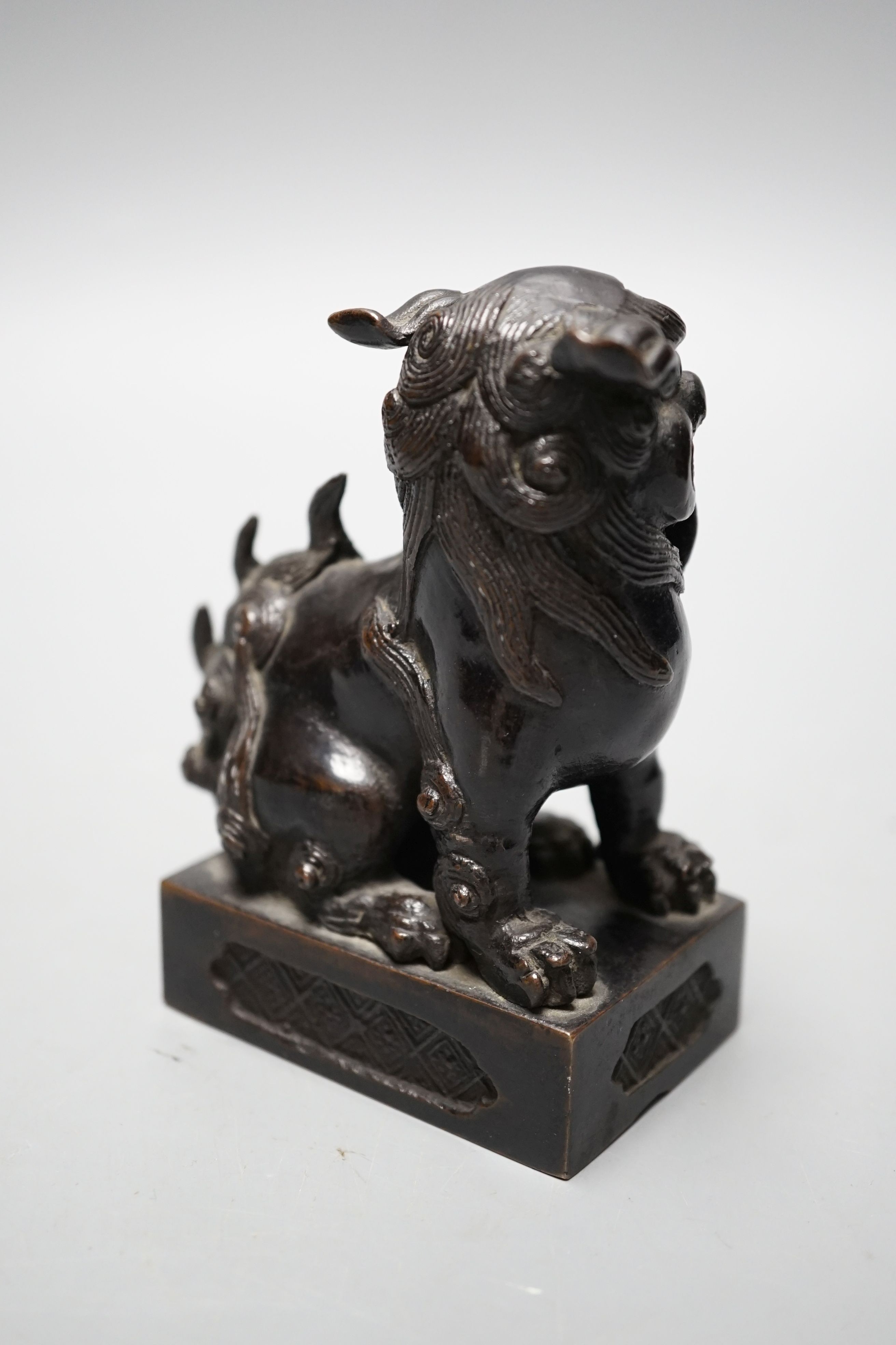 A Japanese bronze Buddhistic lion, Nogara, Noburu mark to base, 11cm